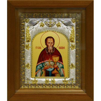 Икона освященная "Иоанн (Иван) Кронштадский праведный чудотворец" из серебра 925 пробы, 14x18 см, в деревянном киоте 20x24 см фото