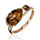 Кольцо с раухтопазом и  фианитом из красного золота 585 пробы